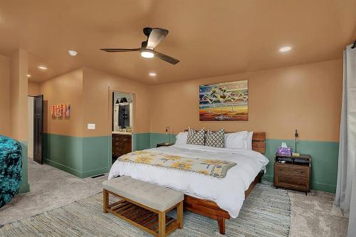a bedroom with a large bed and a ceiling fan at Walk to Bars and Restaurants in Fountain Square in Indianapolis