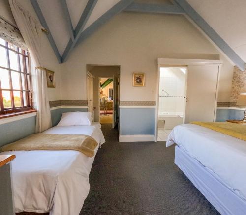 Letto o letti in una camera di Westlodge at Graskop B&B
