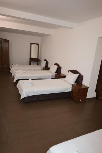 a row of beds in a room at Hotel Lobo Budva in Budva
