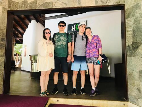 a group of people standing in front of a mirror at Hotel Kamrel Sigiriya in Sigiriya