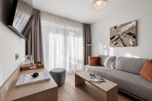 TV a/nebo společenská místnost v ubytování Aparthotel Tante Trude