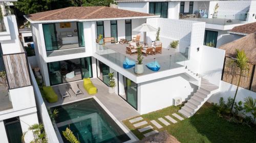 an aerial view of a house with a swimming pool at The Guu Villas - Luxe Seaview Villa Resort in Ko Lanta