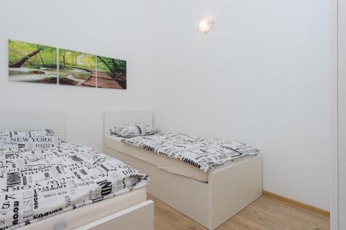 a bedroom with a bed in a room at M.G Apartments in Brodarica