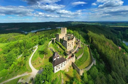 an aerial view of a castle on a hill at Brána do České Kanady in Český Rudolec