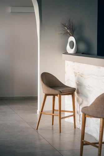 a chair in a room with a fireplace at Hotel Approdo di Venere in Vieste