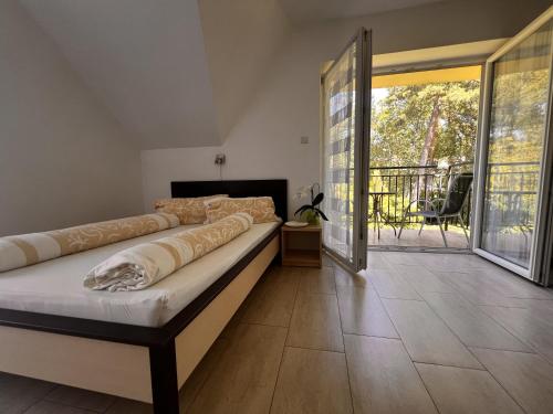 Postel nebo postele na pokoji v ubytování Domy szeregowe Klif