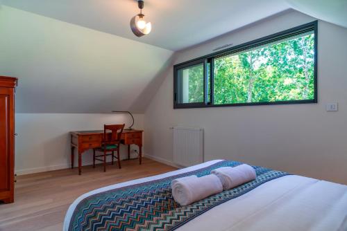 Postel nebo postele na pokoji v ubytování Le Lodge de Sainte-Anne - Cadre bucolique