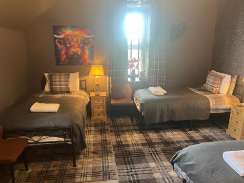 Una cama o camas en una habitación de Glendagreet