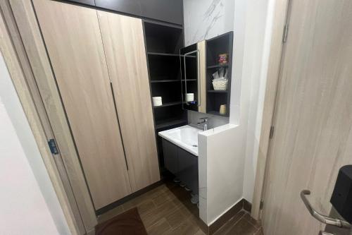 a small bathroom with a sink and a mirror at Thao Trang Luxury Hotel Quang Binh in Dong Hoi