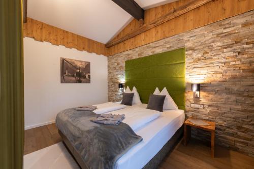 A bed or beds in a room at Landhotel Anna