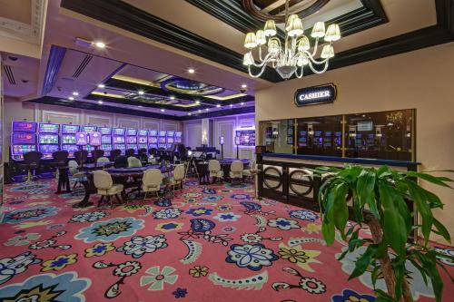 a casino lobby with a poker table and a bar at Liman Hotel & Casino by Merit in Kérynia