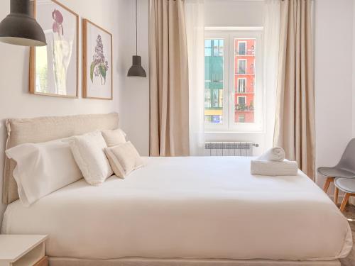 Ένα ή περισσότερα κρεβάτια σε δωμάτιο στο Santa Ana Plaza by Clabao