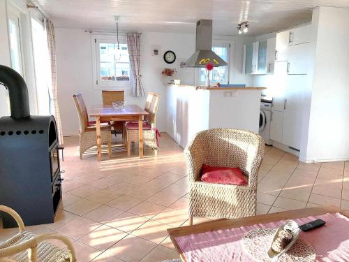 a kitchen and living room with a table and chairs at Ferienpark Scharmützelsee in Wendisch Rietz
