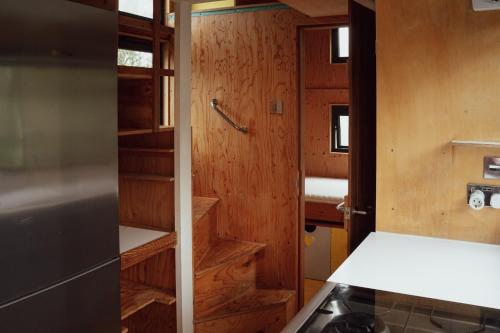 a kitchen with a stove and a door to a room at Quinta do Luzio in Sintra