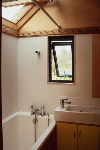 a bathroom with a sink and a window at Quinta do Luzio in Sintra