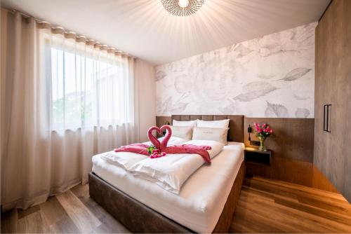 Ένα ή περισσότερα κρεβάτια σε δωμάτιο στο La Rosea - Fine Living Apartments