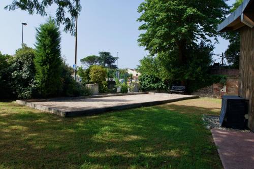 a park with a large concrete slab in the grass at Résidence de Diane - Toulouse in Toulouse