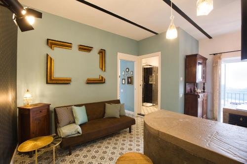 a living room with a couch and a table at Suite Vista Lago Nemi Relax Roma in Nemi