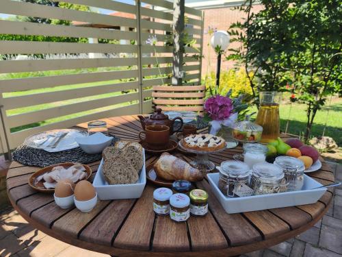 a wooden table with food on top of it at Bed and Breakfast CASA MANU in Loro Ciuffenna
