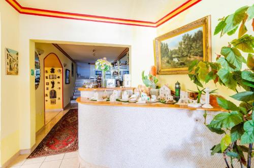a bar in a restaurant with a counter at Hotel Pansion Villa Antonio in Orebić