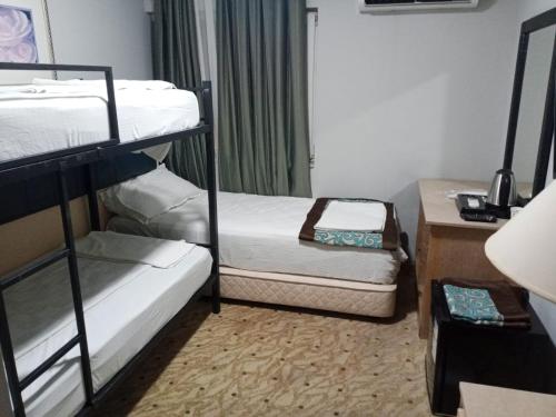 Katil atau katil-katil dalam bilik di Sever Hotel