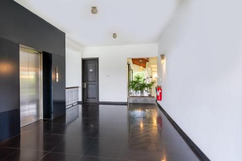 a hallway with black and white walls and a fire hydrant at Lavendish Tamarind Lifestyle in Kataragama