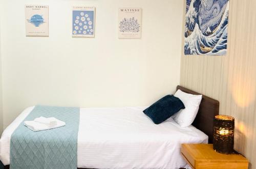 Letto o letti in una camera di R Inn岸里 R-Inn Kishinosato