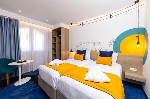 Cama o camas de una habitación en Hotel Carlton
