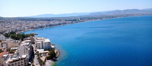 an aerial view of a city next to a large body of water at Flat studio in Loutraki in Loutraki