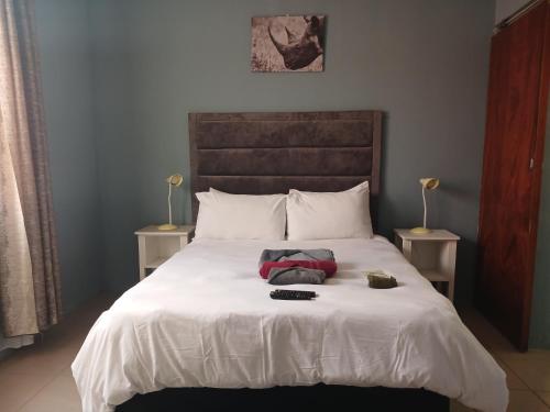 Ένα ή περισσότερα κρεβάτια σε δωμάτιο στο Ikhayalam bed and breakfast