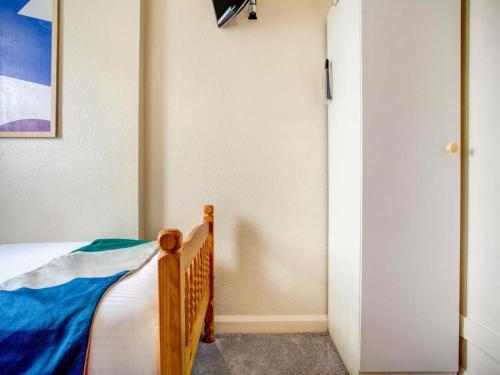 a bedroom with a bed and a painting on the wall at GNDJ Hotel Skegness in Skegness