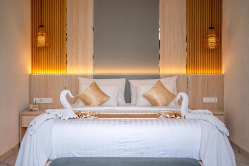 Ένα ή περισσότερα κρεβάτια σε δωμάτιο στο Dikubu Bali Villa and Suites