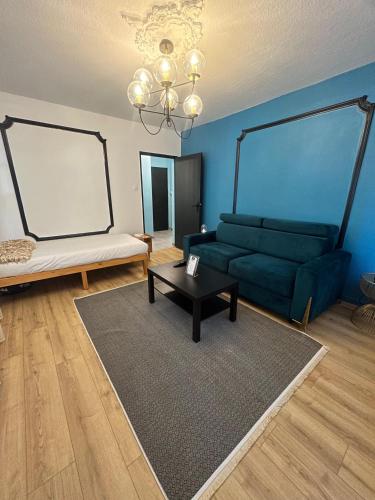 a living room with a couch and a table at Petite France Apartment Strasbourg in Strasbourg