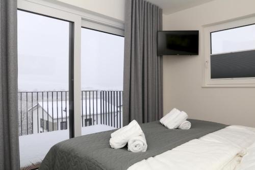 Ένα ή περισσότερα κρεβάτια σε δωμάτιο στο Ferienhaus Diemelblick 19 - besonders familienfreundlich mit Terrasse, Sauna und Garten für 4 Gäste