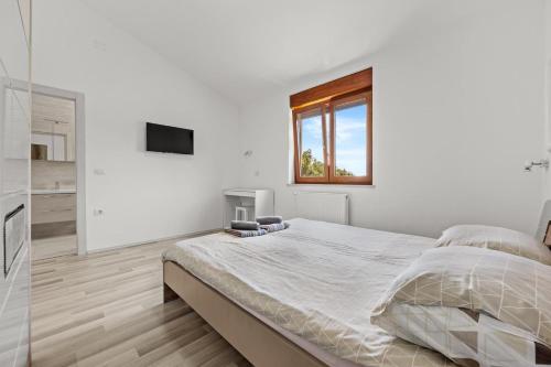 Postel nebo postele na pokoji v ubytování Villa Markulin, Šišan