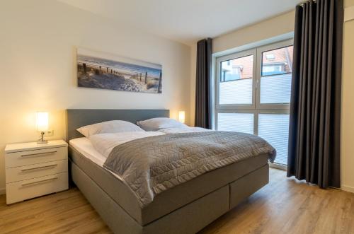 Postel nebo postele na pokoji v ubytování Ankerplatz für bis zu 4 Gäste plus Kleinkind