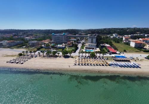 an aerial view of a beach with chairs and umbrellas at EONA BEACH RESORT by Greek Pride in Skála Neón Epivatón