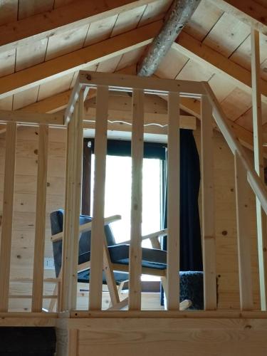 a room in a cabin with a window at Dolomiti House in Cencenighe