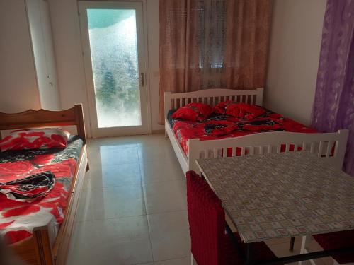 Ένα ή περισσότερα κρεβάτια σε δωμάτιο στο Toni Hostel