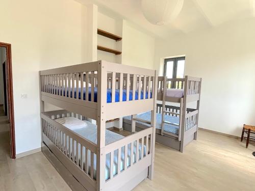 Postel nebo postele na pokoji v ubytování L'appartement Pianosa