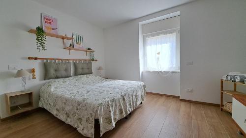 Postel nebo postele na pokoji v ubytování Apartment in Somaggia - CasaCamillo