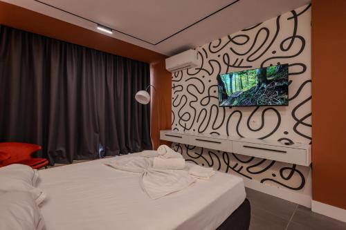 Ένα ή περισσότερα κρεβάτια σε δωμάτιο στο Grandstay Studios