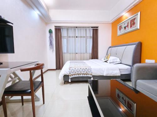 Postel nebo postele na pokoji v ubytování Guangzhou Uhome Service Apartment