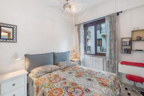 a bedroom with a bed and a window at Terrazzo del gelsomino in Rapallo