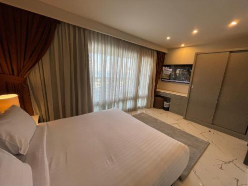 Ένα ή περισσότερα κρεβάτια σε δωμάτιο στο Porto Sokhna Hotel & Spa