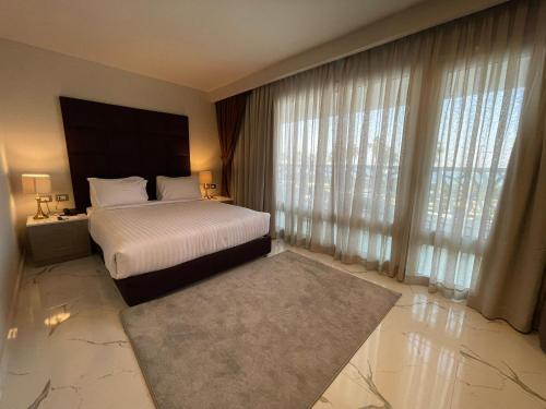 Ένα ή περισσότερα κρεβάτια σε δωμάτιο στο Porto Sokhna Hotel & Spa