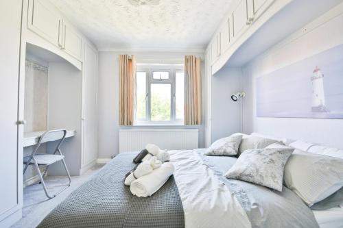 a bedroom with a large bed and a desk at The Wishing Well- Lovely Spacious Home In BS4 Sleeps 8 By STAE- Homes in Bristol