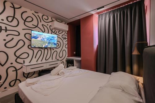 Ένα ή περισσότερα κρεβάτια σε δωμάτιο στο Grandstay Studios