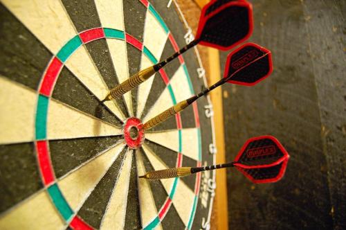 a dart board with two darts in the middle at Pickalbatros Aqua Blu Sharm El Sheikh in Sharm El Sheikh