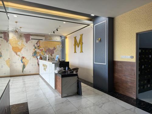 an office with a map of the world on the wall at Manhattan Suite ITCC by 8Avenue in Kota Kinabalu